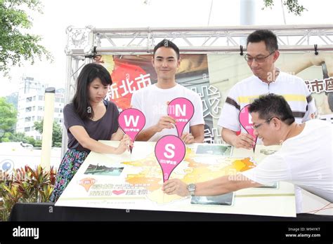 Taiwanese Actor Ethan Ruan Second Left Poses During A Pro Bono