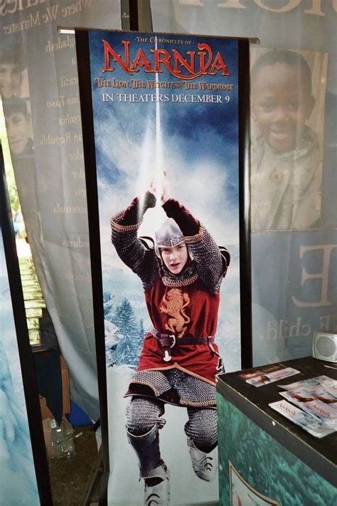 A Movie Poster Is On Display In Front Of A Banner For The Film Narnda