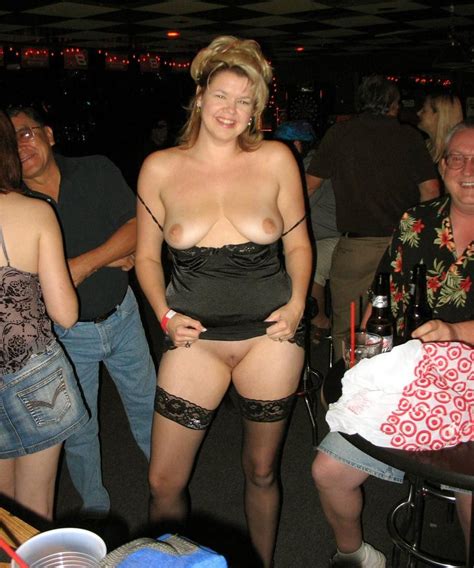 Lady In A Short Party Dress Posing Almost Nude In A Party