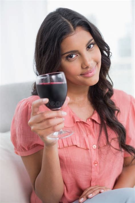 Smiling Cute Brunette Sitting On Couch Holding Wine Glass Stock Photo Image Of Couch Years