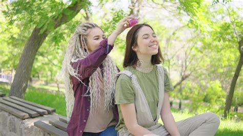 Caring Curly Lesbian Woman Brushing Hair Of Her Happy Girlfriend Stock Video Video Of Outdoors