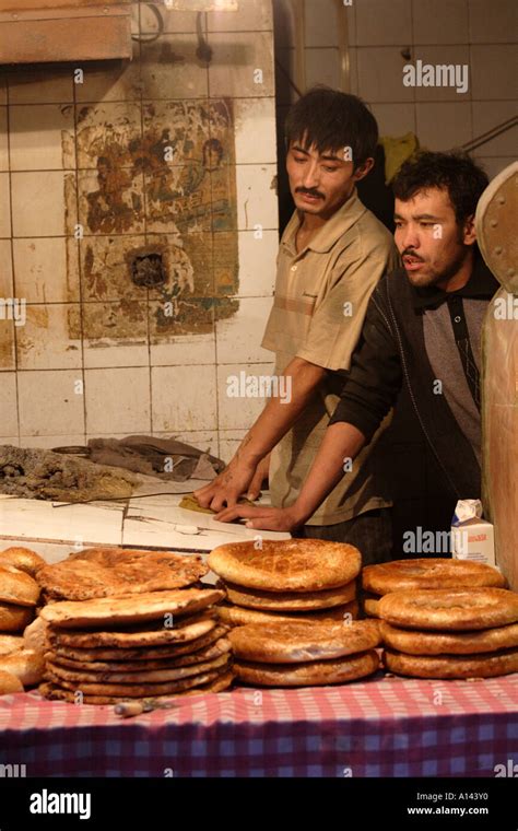 Men From Western Provinces Of China Making Central Asian Bread In A Stone Oven Shanghai China