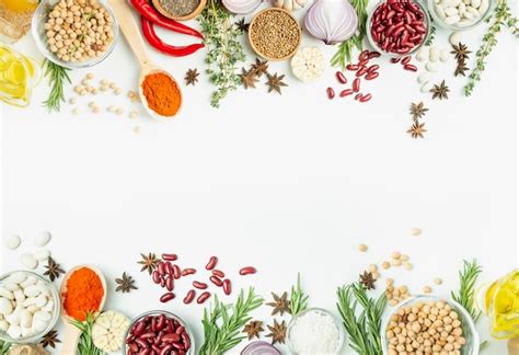 Premium Photo | A variety of spices and herbs on a light table. cooking ...