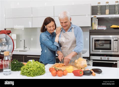 Mature Woman Cooking Kitchen Hi Res Stock Photography And Images Alamy