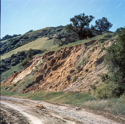 A hillside with erosion and signs of potential landslide risk | Premium