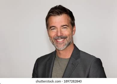 Portrait Mature Man Smiling Camera Isolated Stock Photo 1897282840 Shutterstock