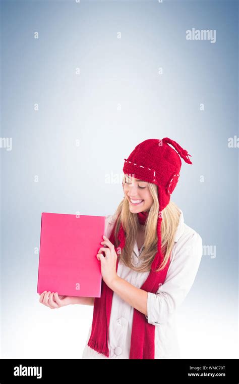 Pretty Blonde Showing Red Poster On Vignette Background Stock Photo Alamy