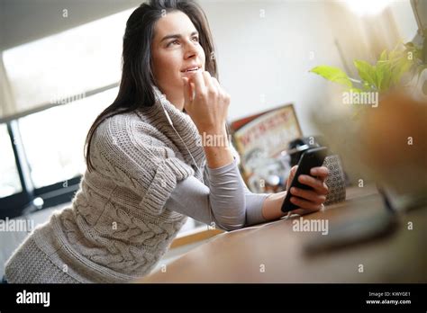 Brunette Girl With Long Hair Talking On Phone With Earphones Stock Photo Alamy