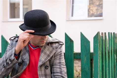 Premium Photo A Man In A Black Hat On A City Street Urban Lifestyle