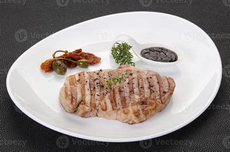 Grilled pork steak with pepper sauce 8446232 Stock Photo at Vecteezy