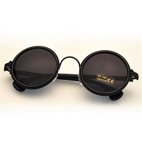 Black Sunglasses With Crow S Feet Ends And Dark Lenses