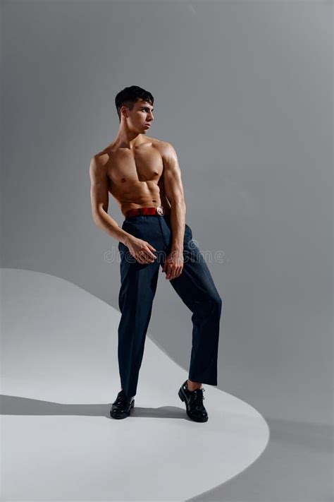 Man In Jeans Patent Shoes Lifted His Leg Up And Naked Torso Bodybuilder Stock Photo Image Of