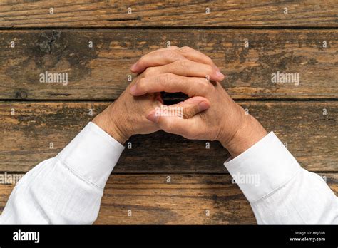 Hands interlaced hi-res stock photography and images - Alamy