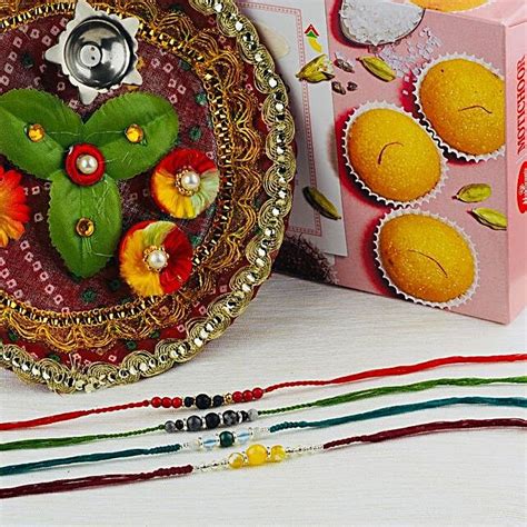 Hamara Parivar Four Rakhi Set With Puja Thali And Motichoor Laddu