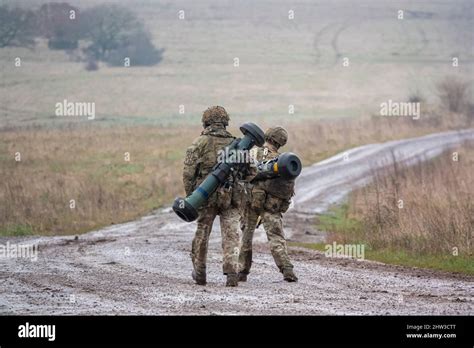 British Army Soldiers Completing An 8 Mile Combat Fitness Test Tabbing