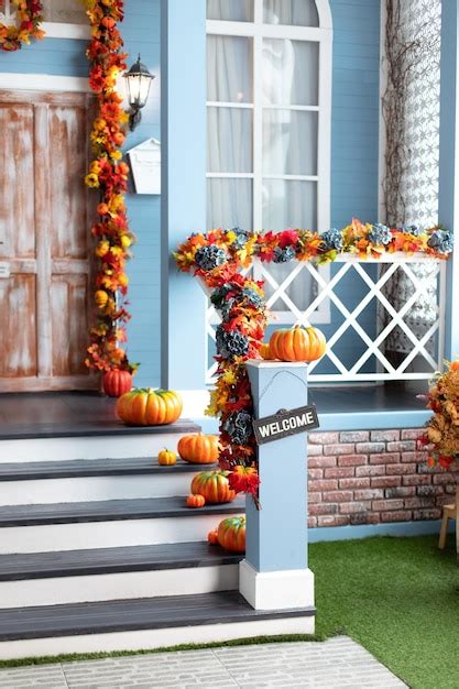 Premium Photo | Halloween design home with yellow fall leaves and lanterns
