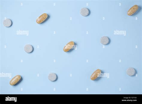 Pills Pattern On Blue Pastel Coloured Background Medication And