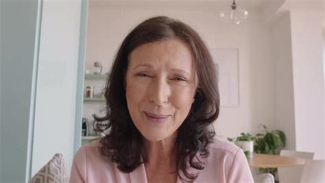 Happy Mature Woman Having Video Chat Using Sign Language On Webcam At Home On Horizontal Screen