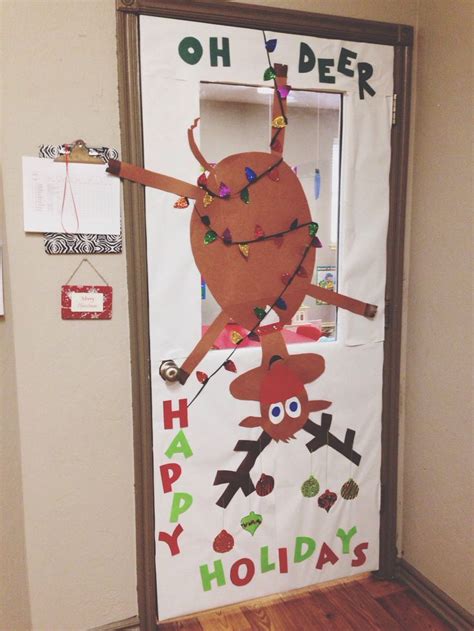 A Door Decorated With An Image Of A Reindeer Holding A Christmas Tree