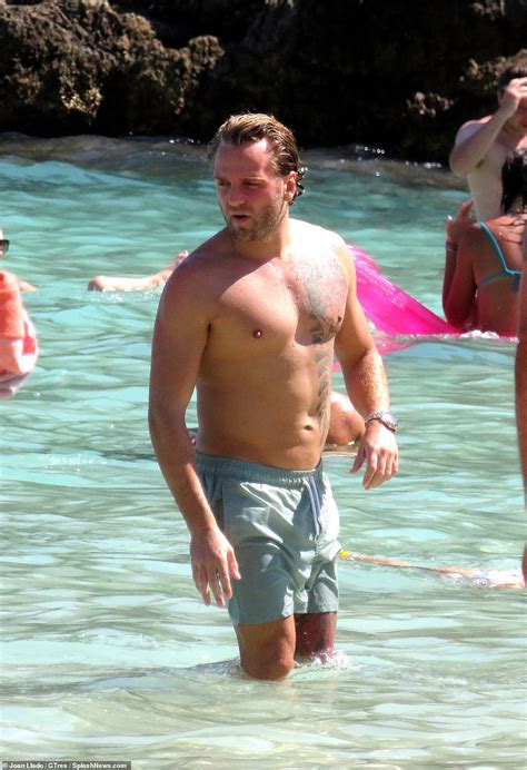 Ferne McCann flaunts her figure in a white bikini during Mallorca trip with fiancé Lorri Haines