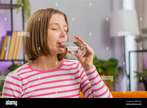 Thirsty Brunette Woman Holding Glass Of Natural Aqua Make Sips Drinking Still Water Preventing