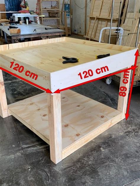 A Table Being Built With Measurements For The Top And Bottom Section On