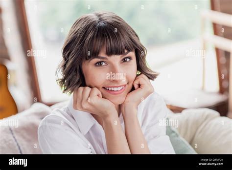 Photo Of Think Brunette Hairdo Millennial Lady Hands Face Wear White Shirt Alone At Home Stock