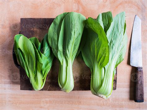 Top View Of Bok Choy On Wooden Chopping Block With Knife 10126437