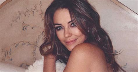 Elizabeth Hurley Looks Sensational In A Plunging White Bikini And Semi Sheer Robe As She