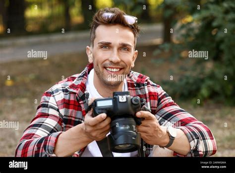 Handsome Male Photographer With Camera Outdoors Stock Photo Alamy