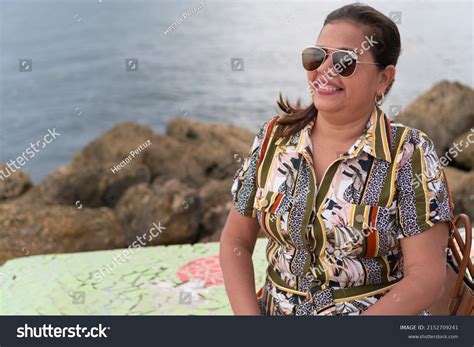 Portrait Confident Mature Woman Sitting On Stock Photo 2152709241 Shutterstock