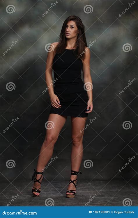 Attractive Muscular Brunette Caucasian Girl Posing In Studio On Isolated Background Style