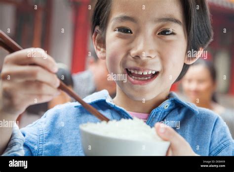 Child Eating Bowl Of Rice Hi Res Stock Photography And Images Alamy