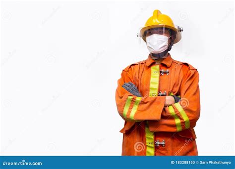 Fireman Standing Among Firefighting Foam And Carrying Fire Hose Reel