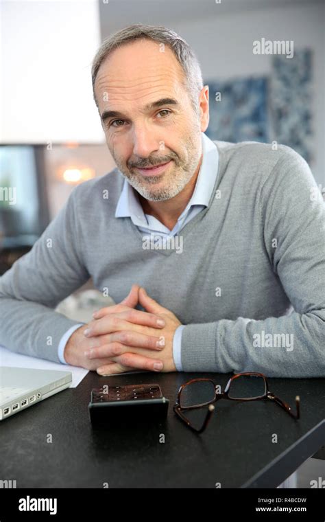Mature Man Working From Home With Laptop Computer Stock Photo Alamy