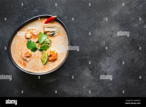 Tom Yam Kung Spicy Thai Soup With Shrimp Seafood Coconut Milk Chili Pepper On Black View