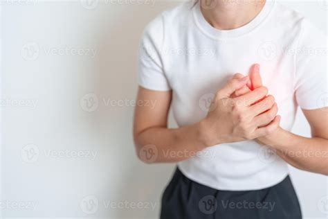 Woman hand holding chest ache. Heart disease, angina disease and