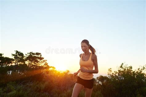 Make Every Run Your Run A Beautiful Brunette Training Outdoors Stock Photo Image Of Mountain