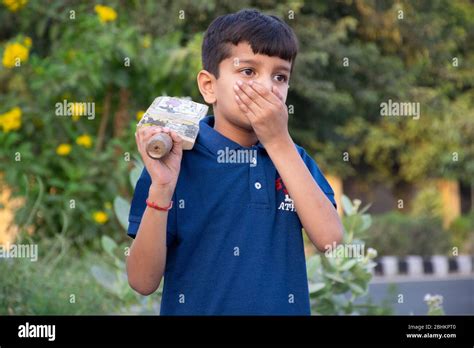 Boy Coughing And Covering Mouth With Hand While Playing Stock Photo Alamy