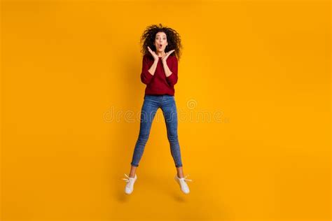 Amazed Slim Brown Haired Model In Coloured Bikini Looking At Her Mobile Phone Stock Image