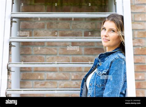 Blonde Woman Sitting On Stairs Hi Res Stock Photography And Images Alamy