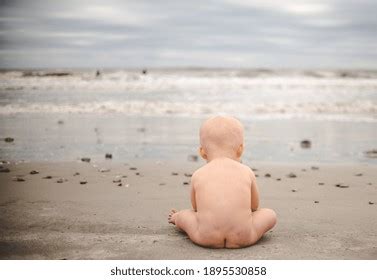 Naked Baby Sitting On Beach Stock Photo Shutterstock