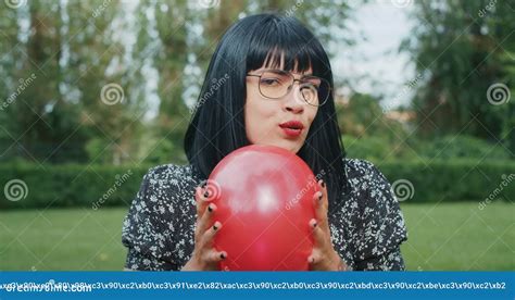 A Joyful Woman Plays With Balloons Imitating The Reliability Of Condoms During Sex They Will