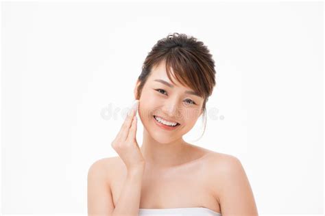 Beauty Portrait Of A Happy Half Naked Asian Woman Removing Make Up With A Cotton Pad Stock Image