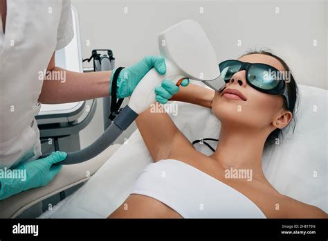 Brunette Woman Getting Laser Hair Removal On Her Face Laser Epilation To Lips Area Facial