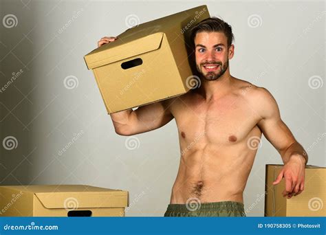 Man With Naked Torso Among Cardboard Boxes Stock Image Image Of Happy Moving