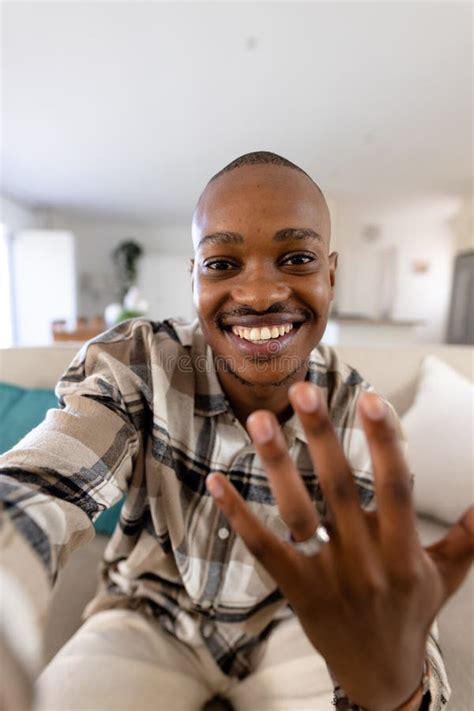 African American Gay Man With Short Hair Showing Wedding Ring While