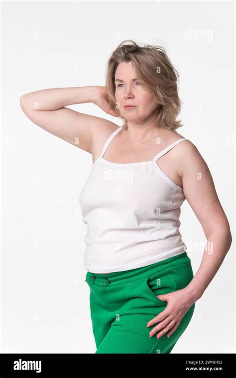 Portrait Of Chubby Mature Adult Blonde Woman Generation X Model Wearing Cotton Camisole And