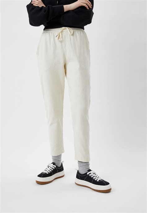 Брюки UNIQLO из ткани джерси, цвет: бежевый, RTLACF586801 — купить в ...