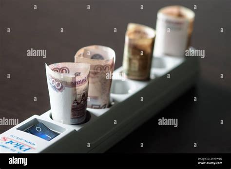 02.10.2023. Russia. Moscow. The rolled-up Russian ruble, which is ...